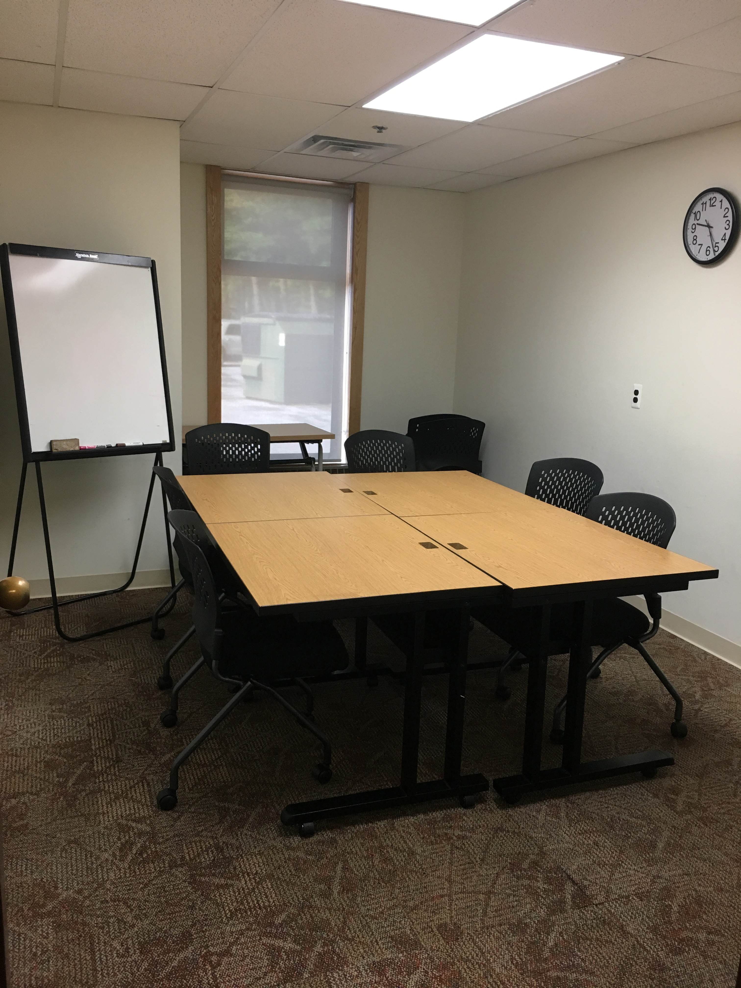 Conference style layout with white board