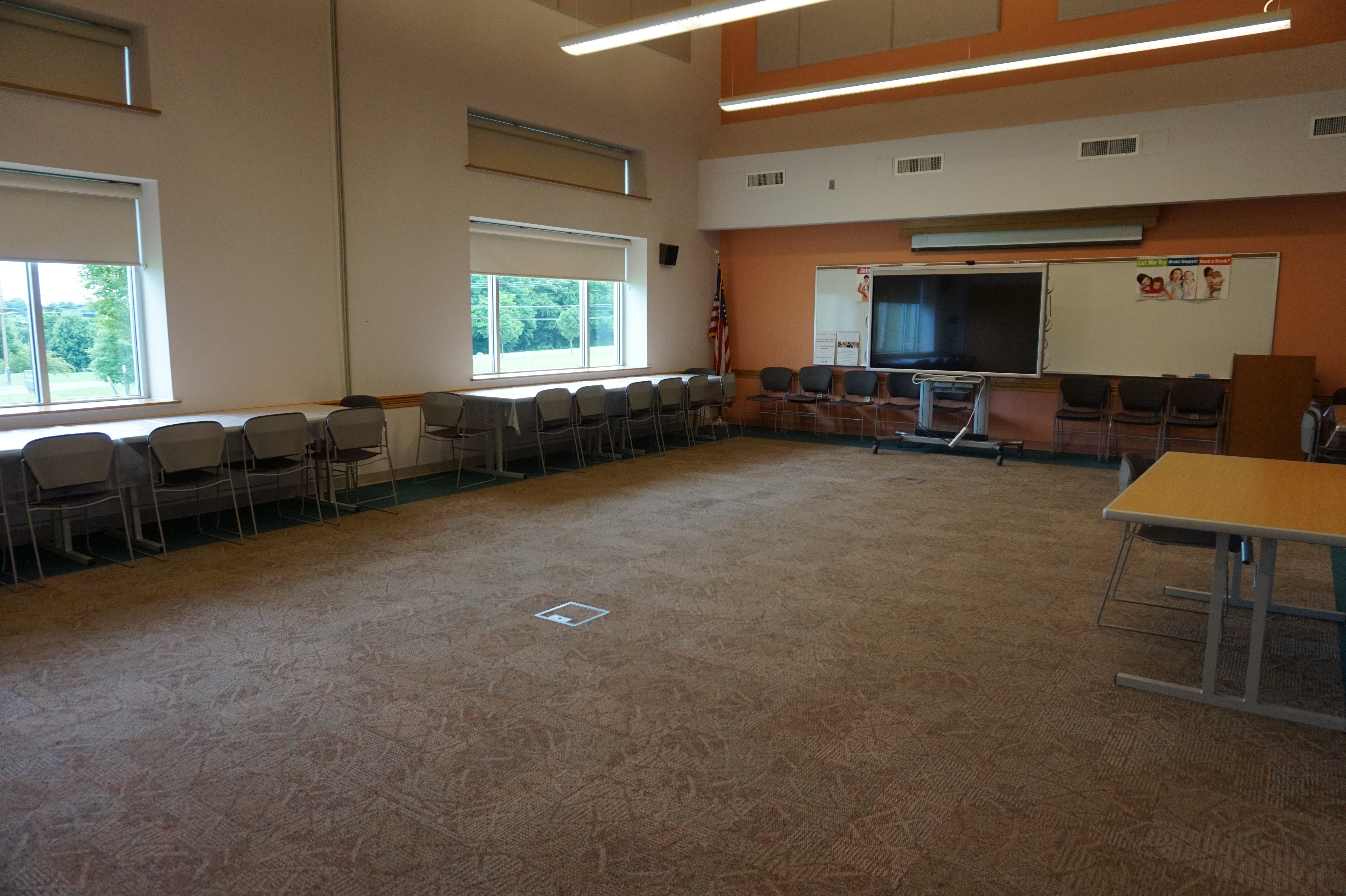 Finksburg large meeting room with open room setup and tables and chairs on side