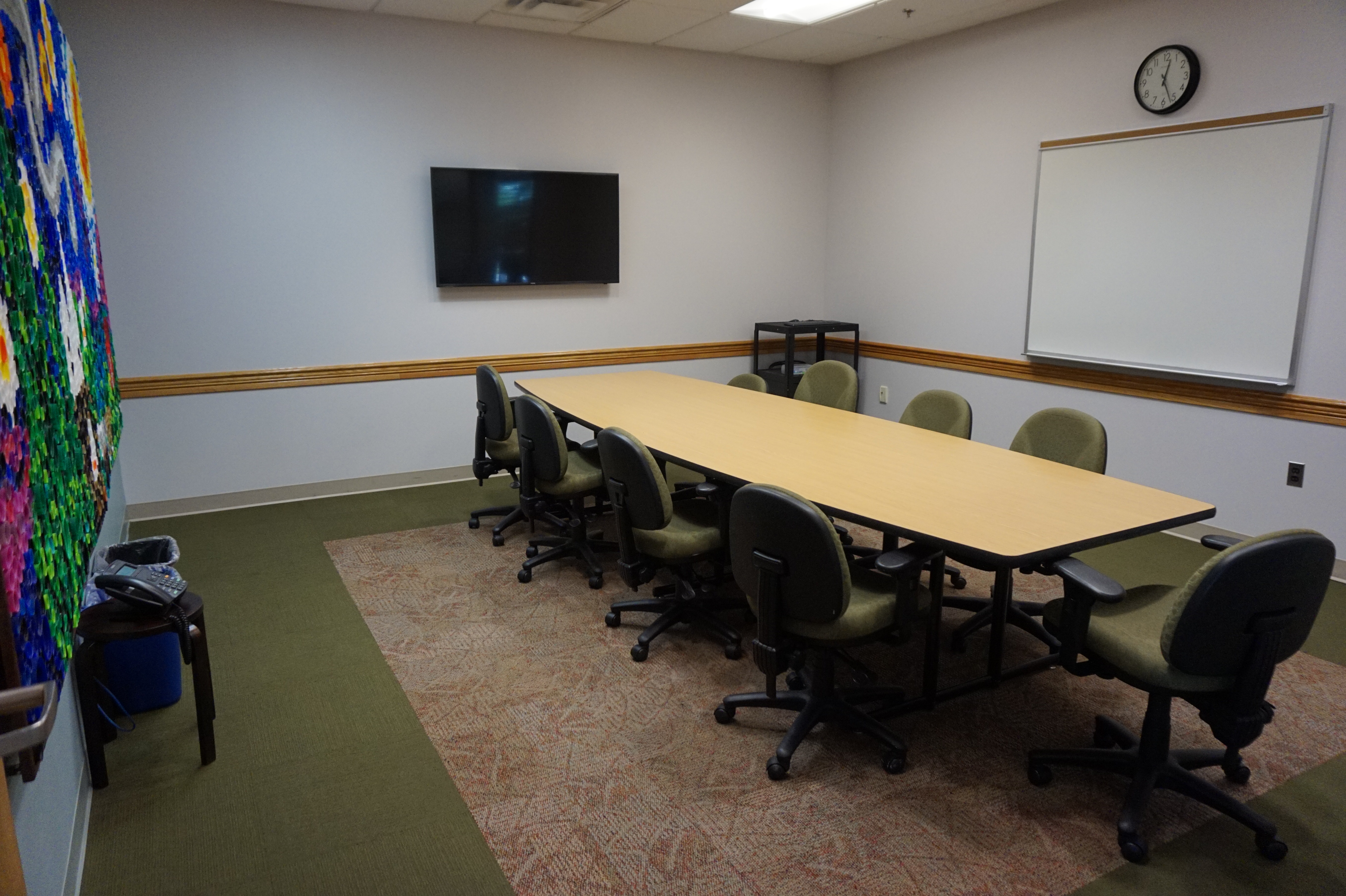 Finksburg small meeting room with a rectangular table and conference-style seating, television and white board mounted on wall