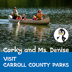 Image of people in canoe on park lake