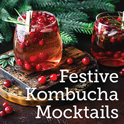 Image of a mocktail on a wooden tabletop with seasonal decor
