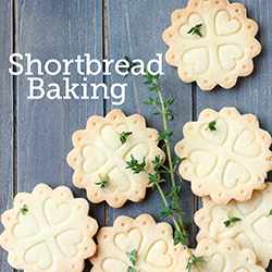 Stamped shortbread cookies on a wooden tabletop