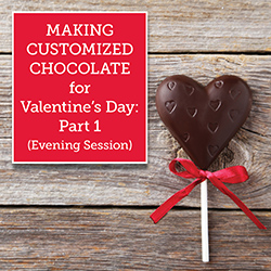 Custom chocolate heart with red bow on wooden tabletop