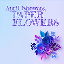 Paper flowers in shades of blue and purple over a light blue background