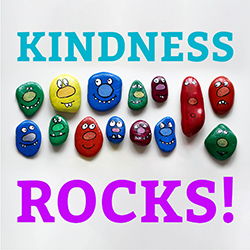 A group of colorfully painted stones with happy faces