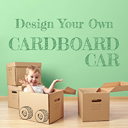 Toddler sitting in cardboard box pretend racecar