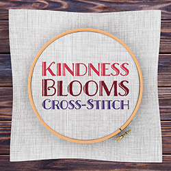 cross-stitch frame with fabric on wooden background