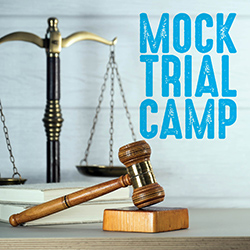 Scales of justice and a gavel on a light blue background