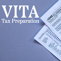 Federal tax forms on the side of a blue-gray paper background