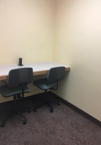 Small study room with two chairs and table