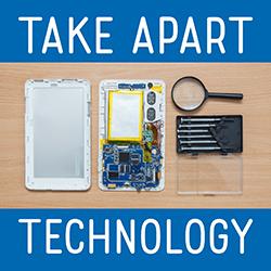 Tablet computer taken apart with tools nearby