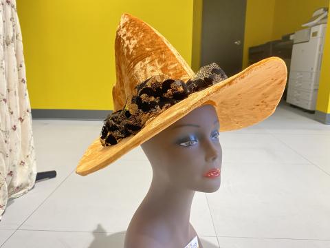 Orange witch hat with black holiday organza decoration
