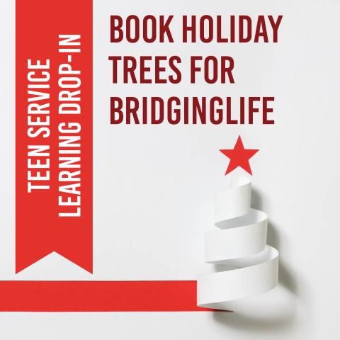 A white paper curl in the shape of a tree with a red paper star on top