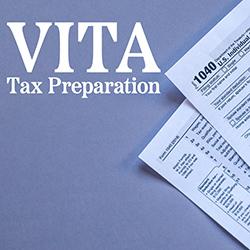Federal tax forms on the side of a blue-gray paper background
