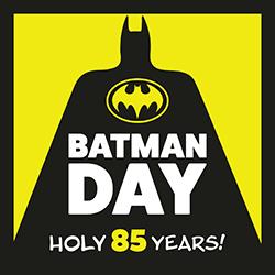 A black Batman silhouette over a yellow background with Batman Day text in white