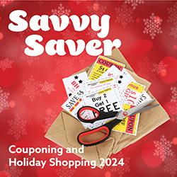 A stack of clipped coupons with scissors over a red snowflake holiday background