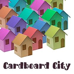 multicolored cardboard houses on a white background