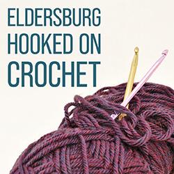 crochet hooks and balls of yarn