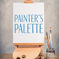 A blank artist's canvas on an easel with a painter's palette underneath and a container of paintbrushes to the right