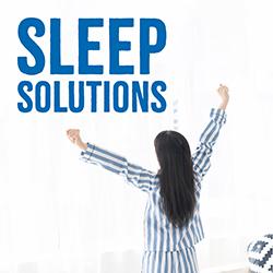 A woman with blue striped pajamas and dark hair stretching in the morning facing away from the camera