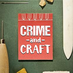 A light brown hand-crafted book surrounded by sharp bookbinding tools on a dark green background.