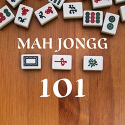 Mah Jongg playing tiles on a wooden board seen from above.