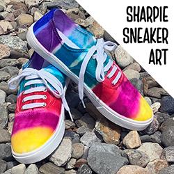 rainbow sneakers on rocks