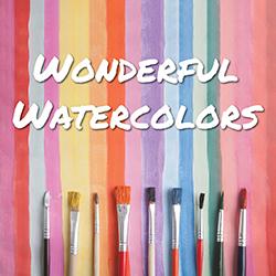 paintbrushes over a watercolor background