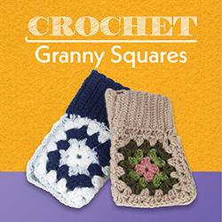 Two crocheted granny square mitts, one blue & white, one beige and greens, over a warm yellow background.