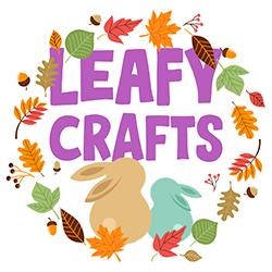 Illustration of two bunnies sitting in a circle of fall leaves above and below them.