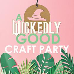 Papercut green leaves and a chipboard witche's hat stencil over a pink background.