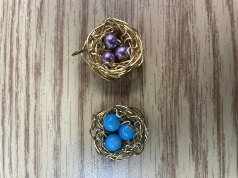 Wire and bead bird's nest pendant.
