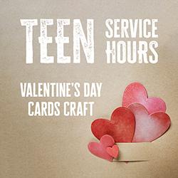 Red paper hearts in a cut paper pocket on brown kraft paper.