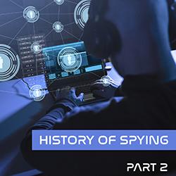 Image in shades of blue of a man wearing headphones using a laptop to monitor cyberspies.