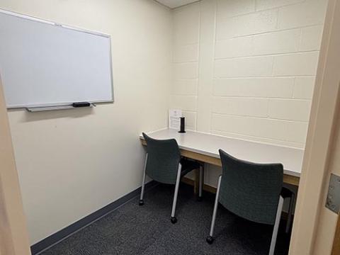 Tutor room with a workbench and two chairs