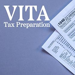 A gray background with two IRS 1040 tax forms at the side tilted into the frame.