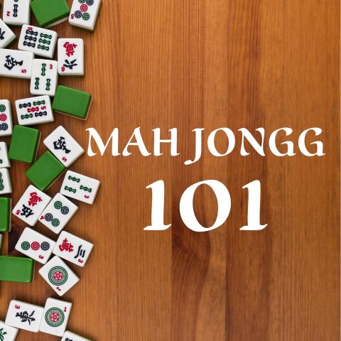 Mah Jongg tiles arranged on a wooden tabletop seen from above.