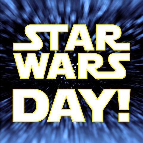 Star Wars Day text in white over a hyper speed space background.