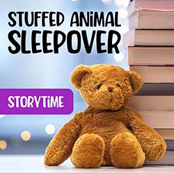 stuffed brown bear toy next to a stack of books in front of a light blue background