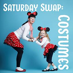 Mother and daughter wearing Minnie Mouse costumes in front of a blue backdrop