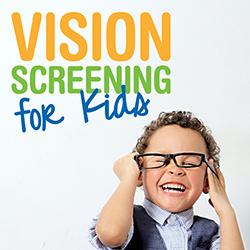 A little boy laughing as he puts on a pair of glasses