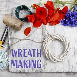Wreath-making supplies on a tabletop seen from above