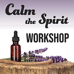 lavender and small bottle with dropper on a piece of wood