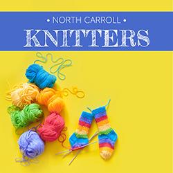 Yarn, knitting, and multicolored socks on a yellow background