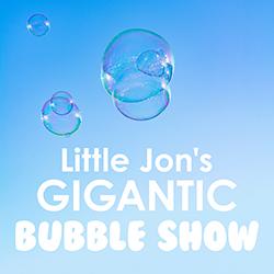 Blue sky with several giant bubbles floating above.