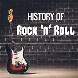 a guitar in front of a brick wall