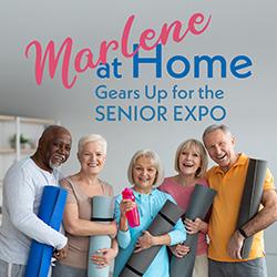 Group of active seniors holding yoga mats.