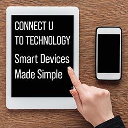 a hand hovering over a tablet with a smart phone next to it