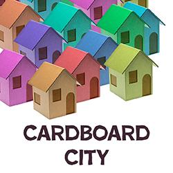 a group of multi-colored cardboard houses