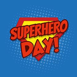Superhero Day classic badge in yellow, red, and blue.